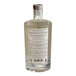An Optimist Botanicals Smokey Non-Alcoholic Spirit bottle with a label on it.