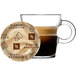 A glass cup of Nespresso Bianco Delicato coffee with brown liquid in it.