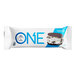 The white and brown package for ONE Cookies and Creme Protein Bars with a close-up of a cookie.
