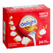 A red box of International Delight Sweet & Creamy non-dairy creamer with a red lid.