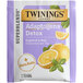 A purple and white box of Twinings Detox Adaptogens Grapefruit & Basil Green Tea with a slice of grapefruit on the side.