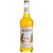 A Monin Premium Pineapple Fruit Syrup bottle.