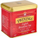 A gold and red Twinings English Breakfast loose leaf tea tin with a lid.