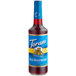 A Torani Sugar-Free Red Raspberry flavoring syrup in a glass bottle with a blue label.