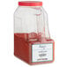 A case of four large containers of Regal ground annatto, a red powder.