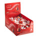A white box of Lindt Lindor milk chocolate truffles.