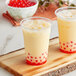 Two cups of milk tea with Bossen Pumpkin Spice Powder on top and red berries.