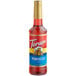 A Torani plastic bottle of hibiscus flavoring syrup with a label.