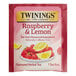 A red Twinings Raspberry & Lemon Herbal Tea bag.