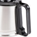 A stainless steel Hamilton Beach coffee carafe with a black handle.