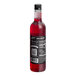 A close-up of a DaVinci Gourmet Classic Prickly Pear Fruit Syrup bottle filled with red liquid.