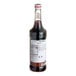 A 750 mL bottle of Monin Premium Blackberry Flavoring / Fruit Syrup.