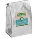 A white bag of Toddy coarse ground coffee with a label.