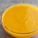 A bowl of Les Vergers Boiron mango puree on a counter.