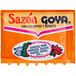 A close up of a Goya Sazon seasoning packet.