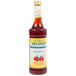 A close up of a Monin Sugar Free Raspberry Fruit Syrup bottle with a label.