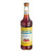 A bottle of Monin Sugar-Free Raspberry Fruit Syrup with a yellow label.