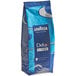 A close up of a blue Lavazza Dek Filtro Decaf Whole Bean Coffee bag with white text.