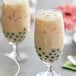 A pair of glasses of bubble tea made with Fanale Wintermelon Concentrated Syrup on a white plate.