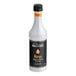 A bottle of Monin Mango Concentrated Flavor, 375 mL size.