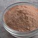 A bowl of Premier Protein chocolate protein powder.