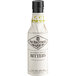 A bottle of Fee Brothers Old Fashioned Aromatic Bitters with a black cap.