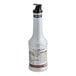A white Monin bottle with a black lid.