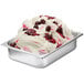 A bowl of white ice cream with Fabbri Amarena Cherry marbling and whipped cream.