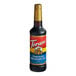 A close up of a Torani Chocolate Macadamia Nut Flavoring Syrup bottle with a gold cap.