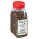 A plastic jar of Regal Gourmet Peppercorn Medley with a label containing black and red peppercorns.