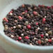 A bowl of Regal Gourmet Peppercorn Medley on a table.