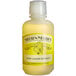 A bottle of Nielsen-Massey Pure Lemon Extract with a yellow label on a counter.