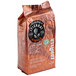A brown Lavazza Tierra! Brasile bag of whole bean coffee with a black and white label.