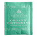 A green Harney & Sons packet of organic peppermint tea bags with white text.