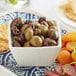 A bowl of Frutto d'Italia pitted Mediterranean olives with dried apricots.