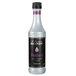 A close up of a Monin Blackberry Concentrated Flavor bottle filled with black liquid.