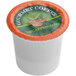 A Caffe de Aroma single serve coffee cup with a green and orange label.