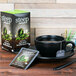 a box of tea with green leaves