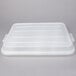 A white plastic Vollrath Color-Mate bus tub lid.