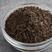 A bowl of Numi Organic Breakfast Blend black loose leaf tea.