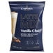 A blue Capora bag of Vanilla Chai Latte mix with a picture of a drink on the label.