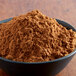 A bowl of brown Regal Pumpkin Pie Spice powder.