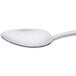 A Oneida stainless steel teaspoon with a white handle.