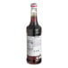 A Monin bottle of Irish Cream flavoring syrup with a white label.