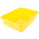 A Vollrath yellow plastic food storage container with a raised snap-on lid.