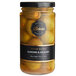 A glass jar of Belosa hickory-smoked almond stuffed queen olives with a black and yellow label.