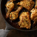 A pan of chicken legs seasoned with Regal Tarragon Leaves.