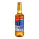 A Torani Salted Honey Butter flavoring syrup bottle with a yellow lid.