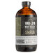 A close up of an 18.21 Bitters Blackberry Peppercorn Shrub bottle.