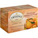 A box of Twinings Honeybush, Mandarin & Orange Herbal Tea with oranges on it.